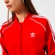 Moteriškas džemperis ADIDAS DŽEMPERIS UŽSEGAMAS   SST TRACKMARŠKINĖLIAI PB he9562 spalva raudona