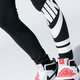 Vaikiškos kelnės NIKE TAMPRĖS SPORTSWEAR 939447-010 spalva juoda