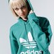 Moteriškas džemperis ADIDAS DŽEMPERIS SU GOBTUVU TRF HOODIE fm3297 spalva žalia