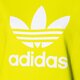Moteriškas džemperis ADIDAS DŽEMPERIS SU GOBTUVU TRF HOODIE he6950 spalva geltona
